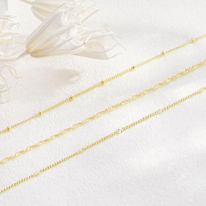 Guldkaskad – Elegant flerskikts halsband i varm guldton