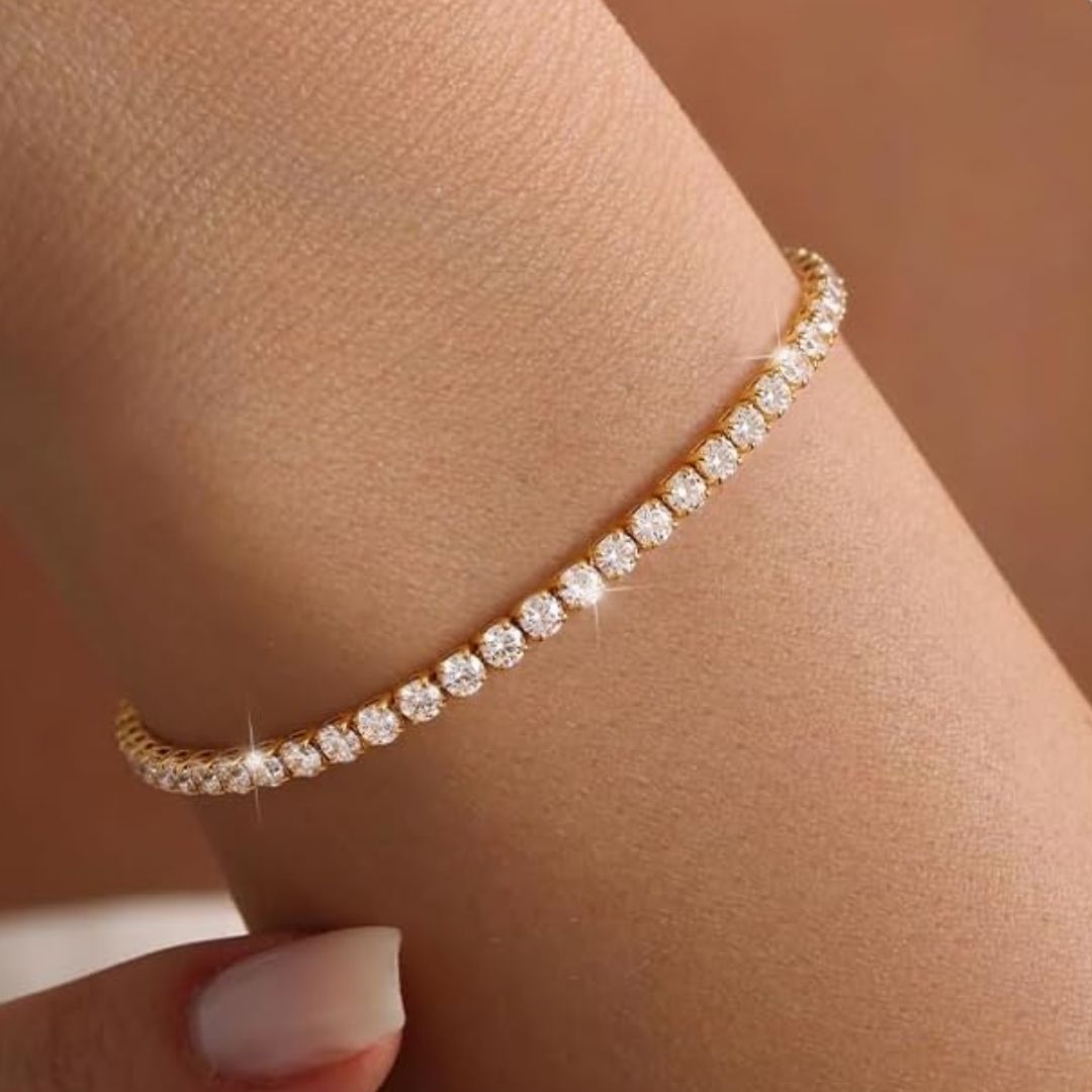 Guldstrimma – Klassiskt tennisarmband med gnistrande kristaller i guldton